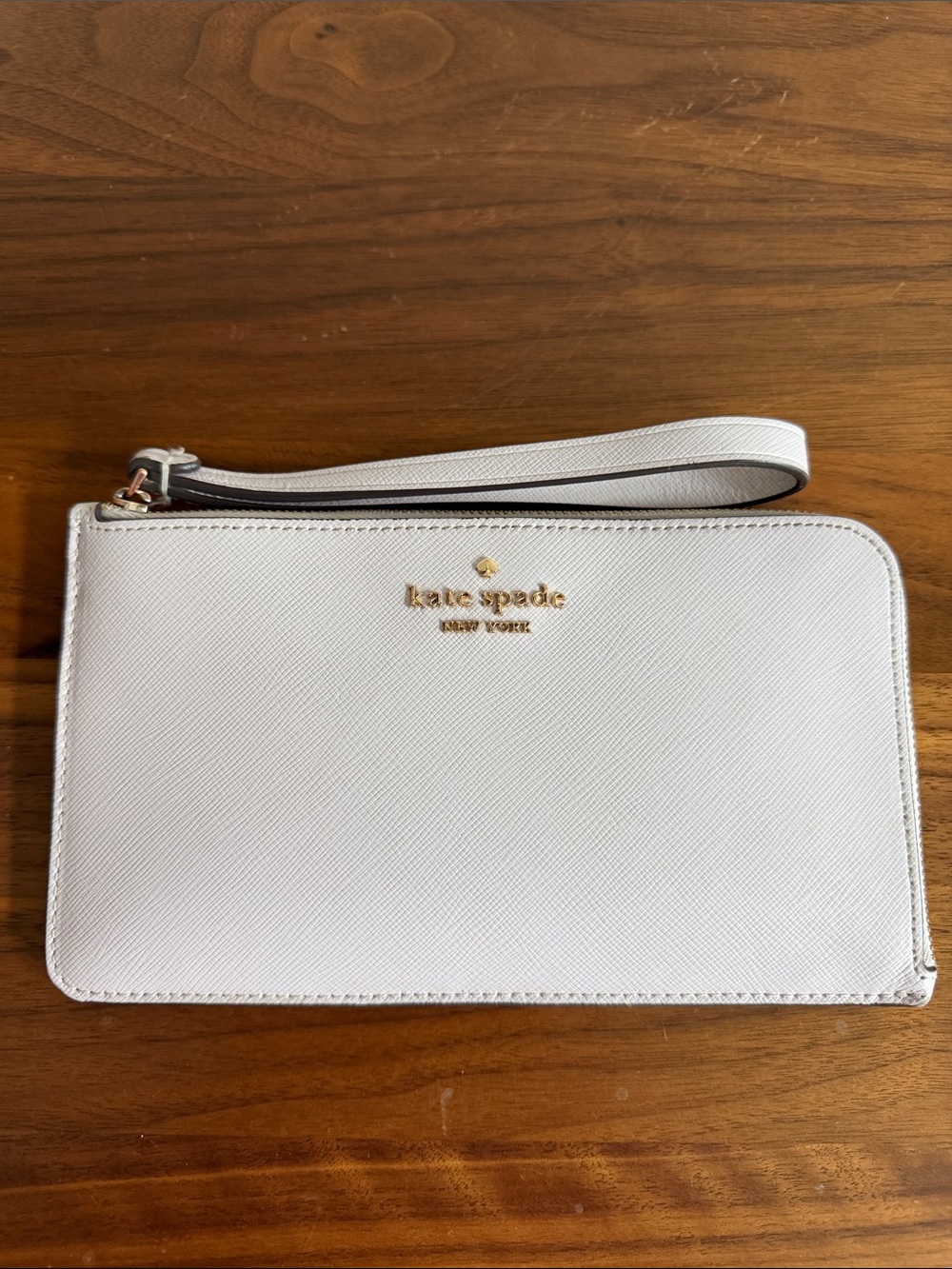 kate spade light purple saffiano wristlet with gold logo